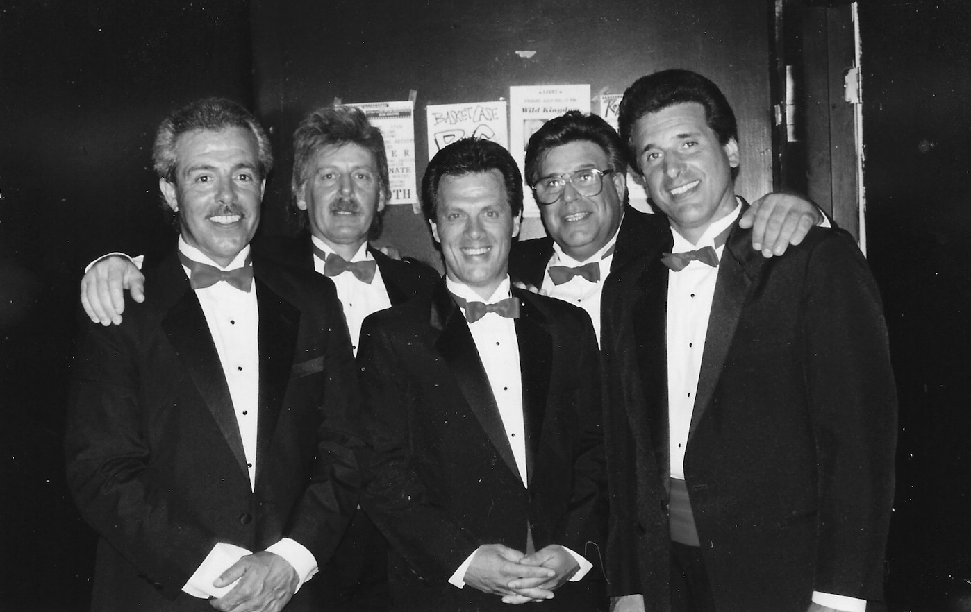 The Devotions posing in tuxedos and bow ties